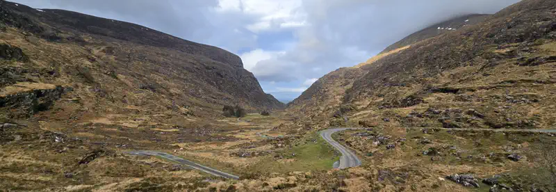 Narrow mountain road winding through the moorland of the Gap of Dunloe, County Kerry, Ireland — Go Move Shift scenic driving footage
